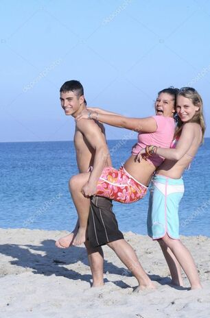 Kids goofing on beach on summer