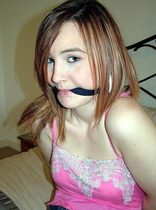 Young womans ball-gagged and